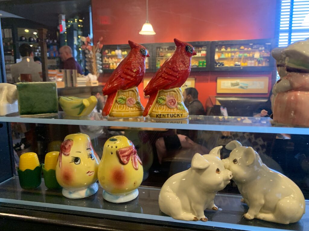 A case of ceramic salt and pepper shakers.