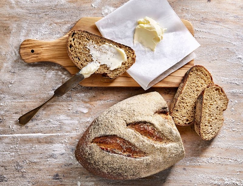 A loaf of Roadhouse Bread with fresh butter.