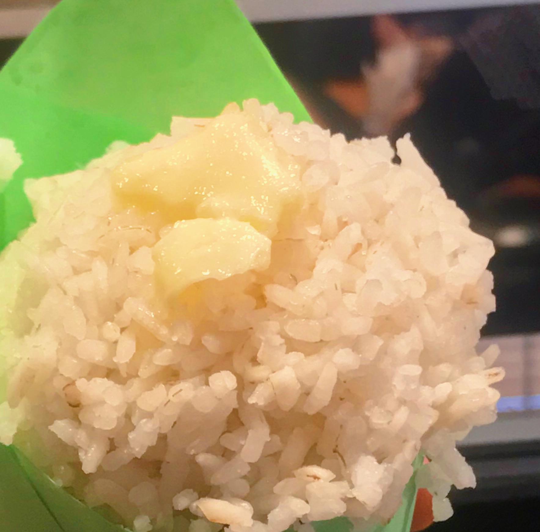 A scoop of Carolina Gold rice with butter melting into it.