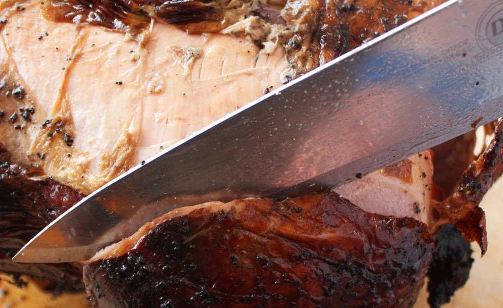 A close-up of the Roadhouse coffee-spiced rubbed turkey being sliced.