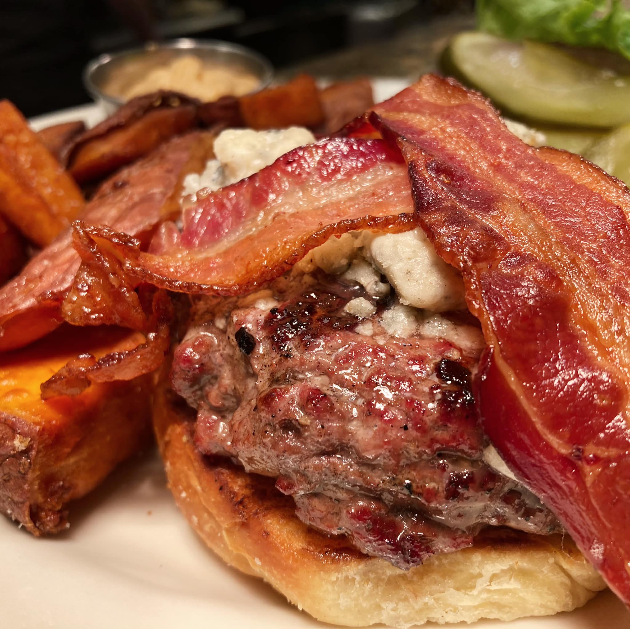 A Roadhouse burger with cheese and bacon.