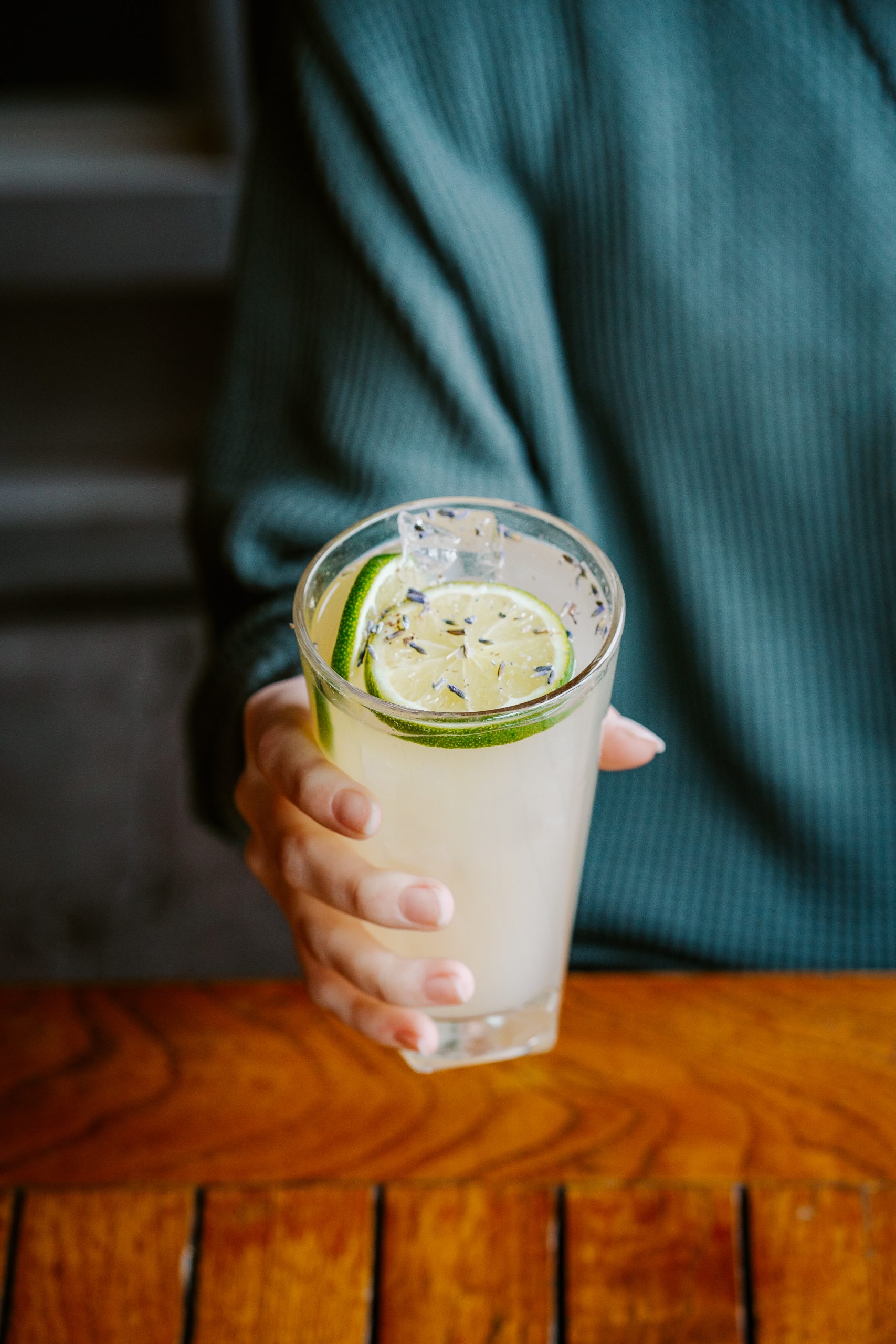 Laura's Nonsense Lavender Lemonade Mocktail with a Twist of Lime and Lavender Sprinkled On Top