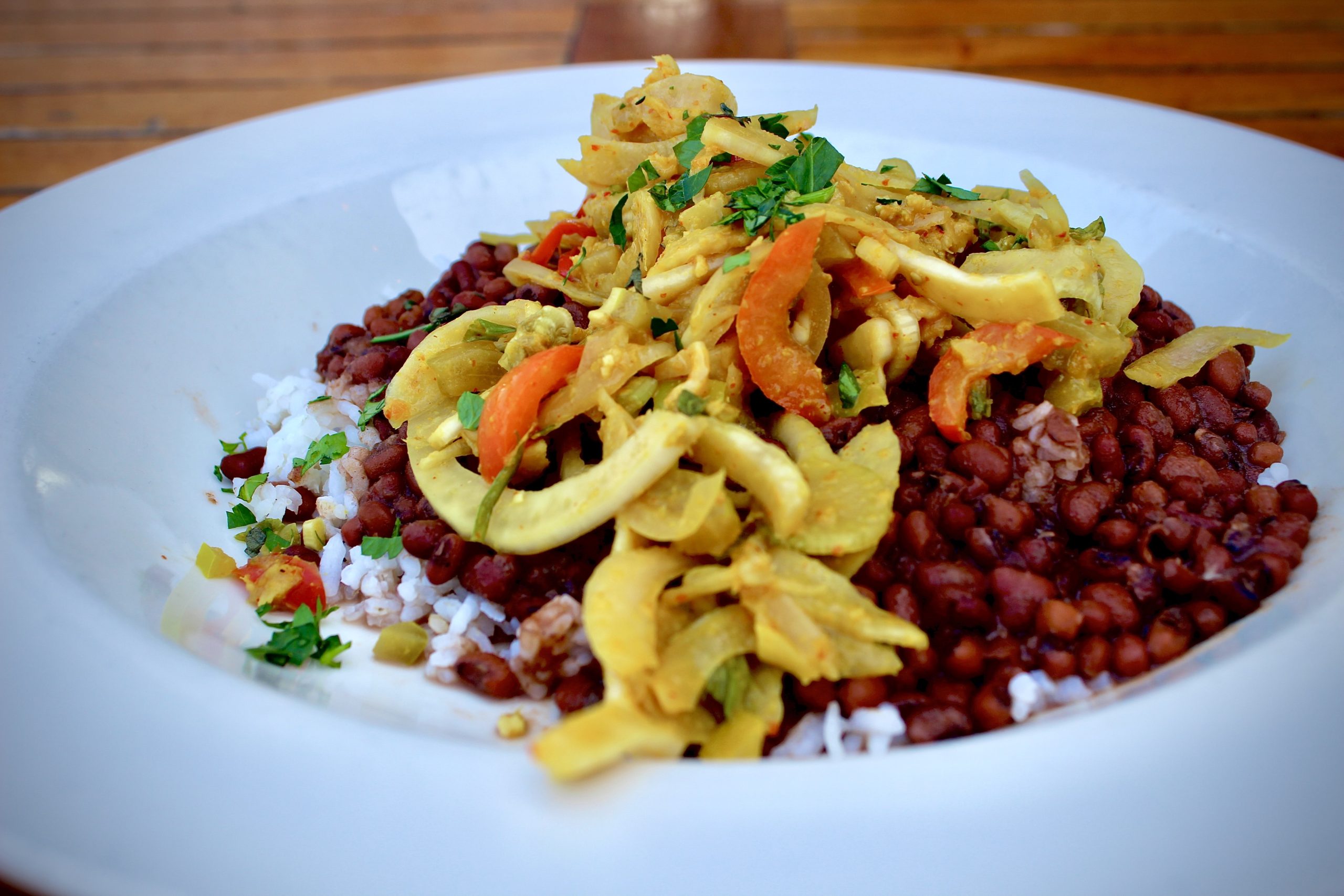 A dish of red peas and rice, topped with a bright fennel slaw.
