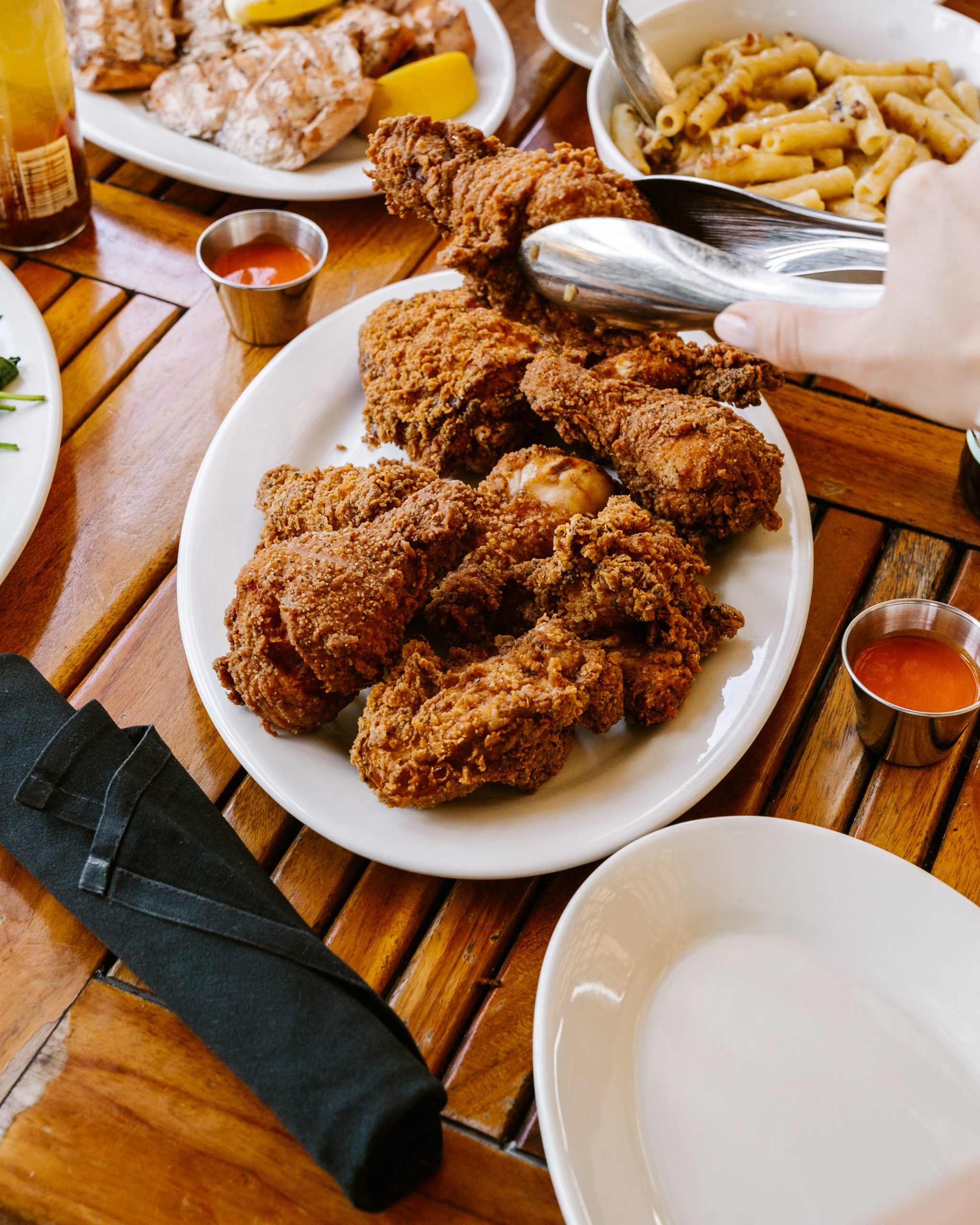 A box of golden, crispy buttermilk fried chicken in assorted pieces.