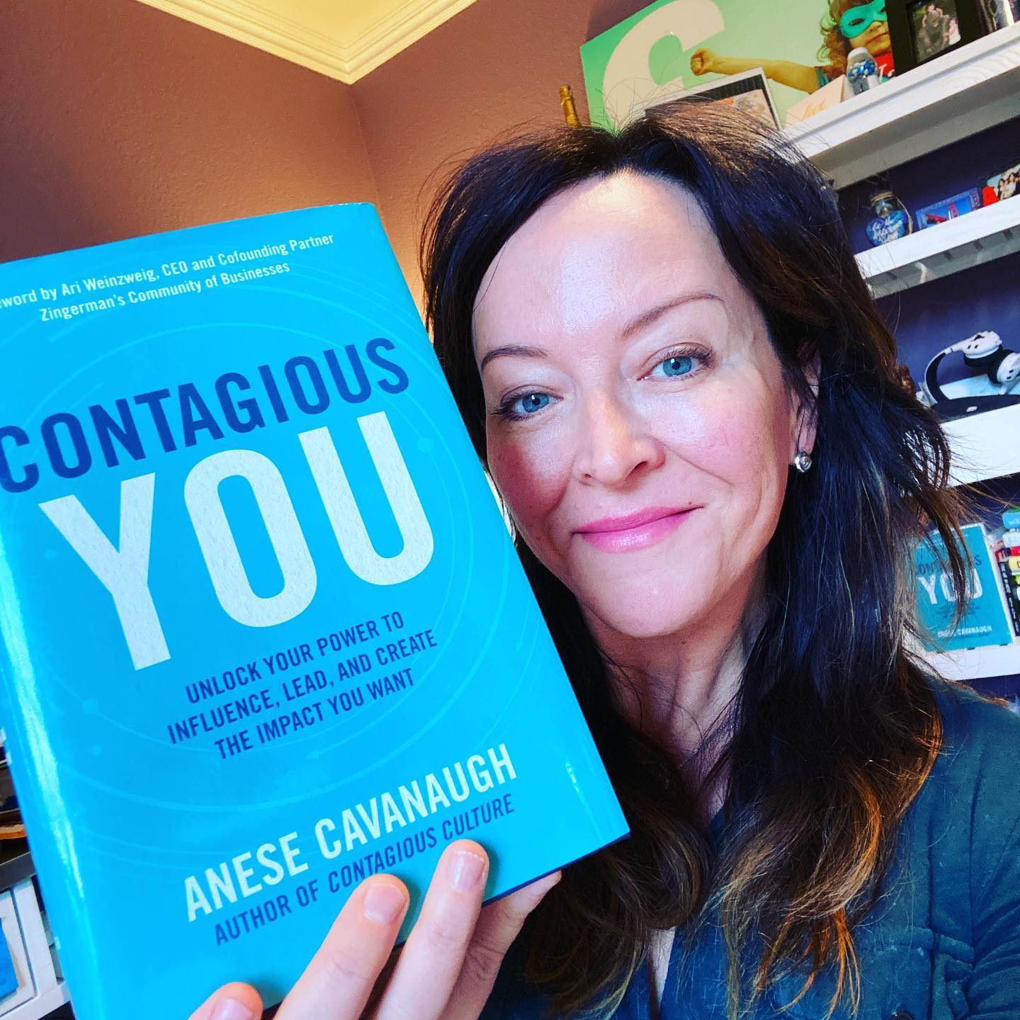 Contagious You Book Held by Anese Cavanaugh