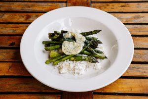 A plate with rice and grilled asparagus and tarragon butter