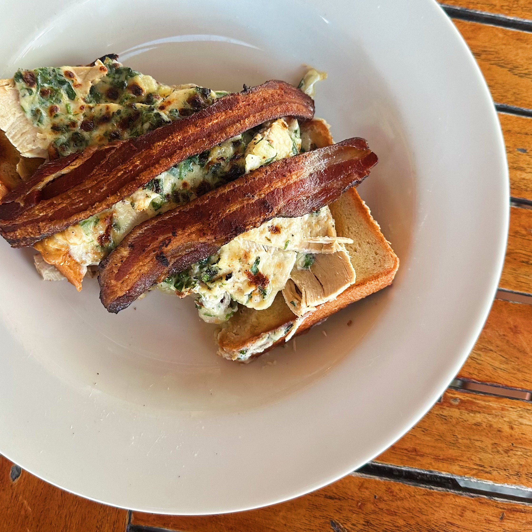 An open faced turkey hot brown sandwich.