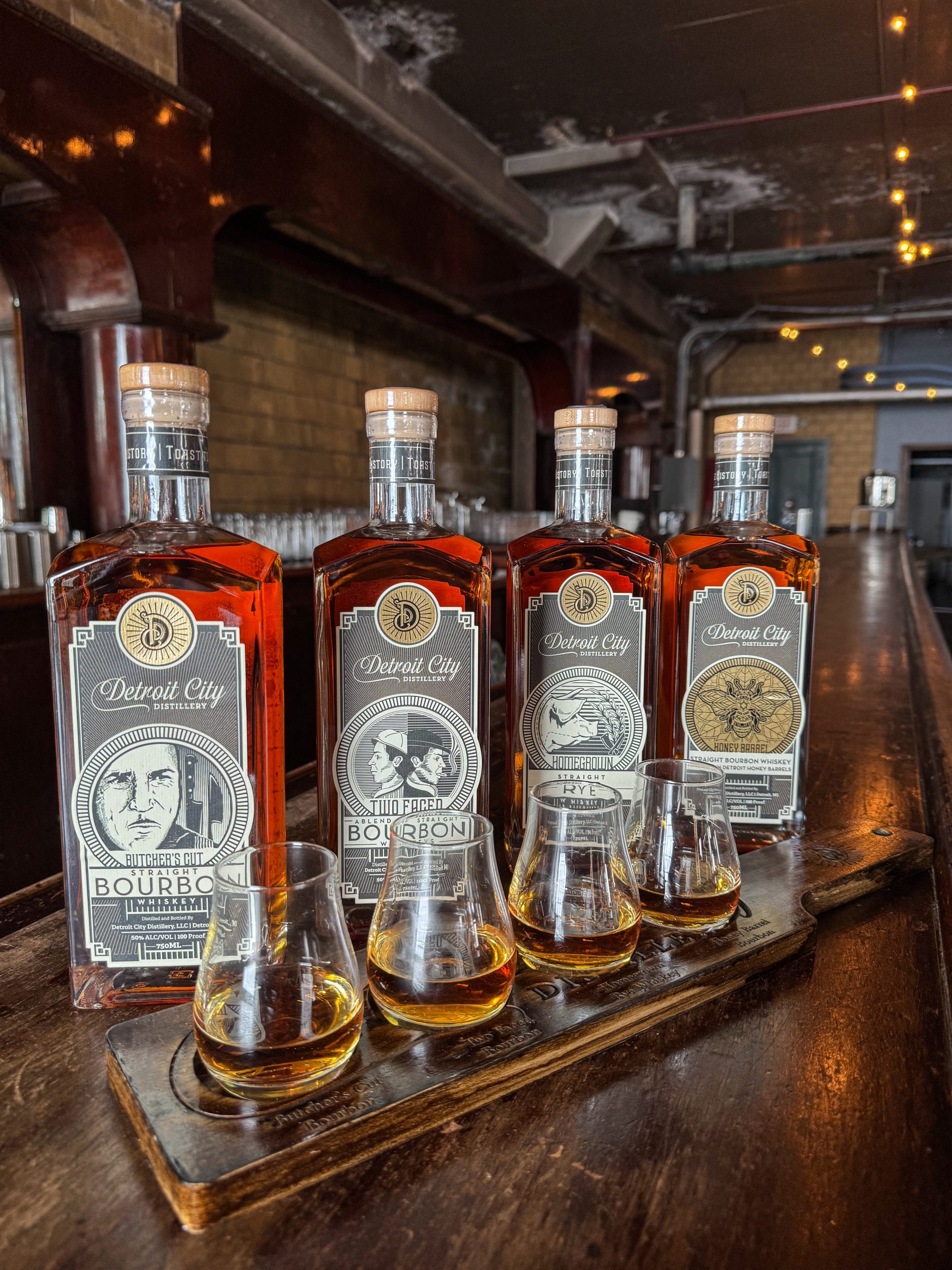 A flight of bottled bourbons from Detroit Distillery